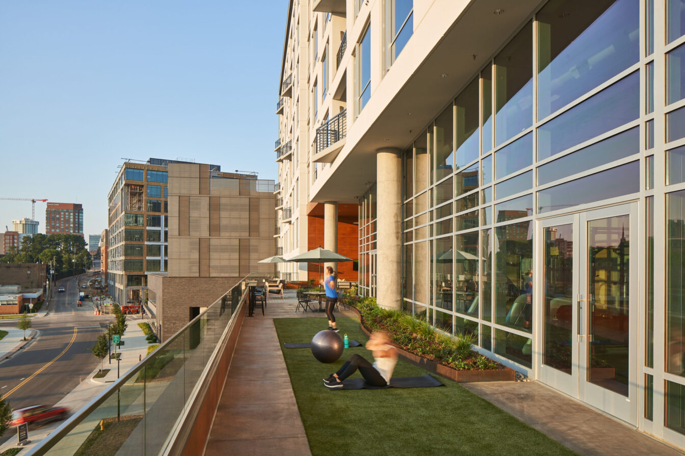 Peace Apartments outdoor fitness space overlooking Harrington activated