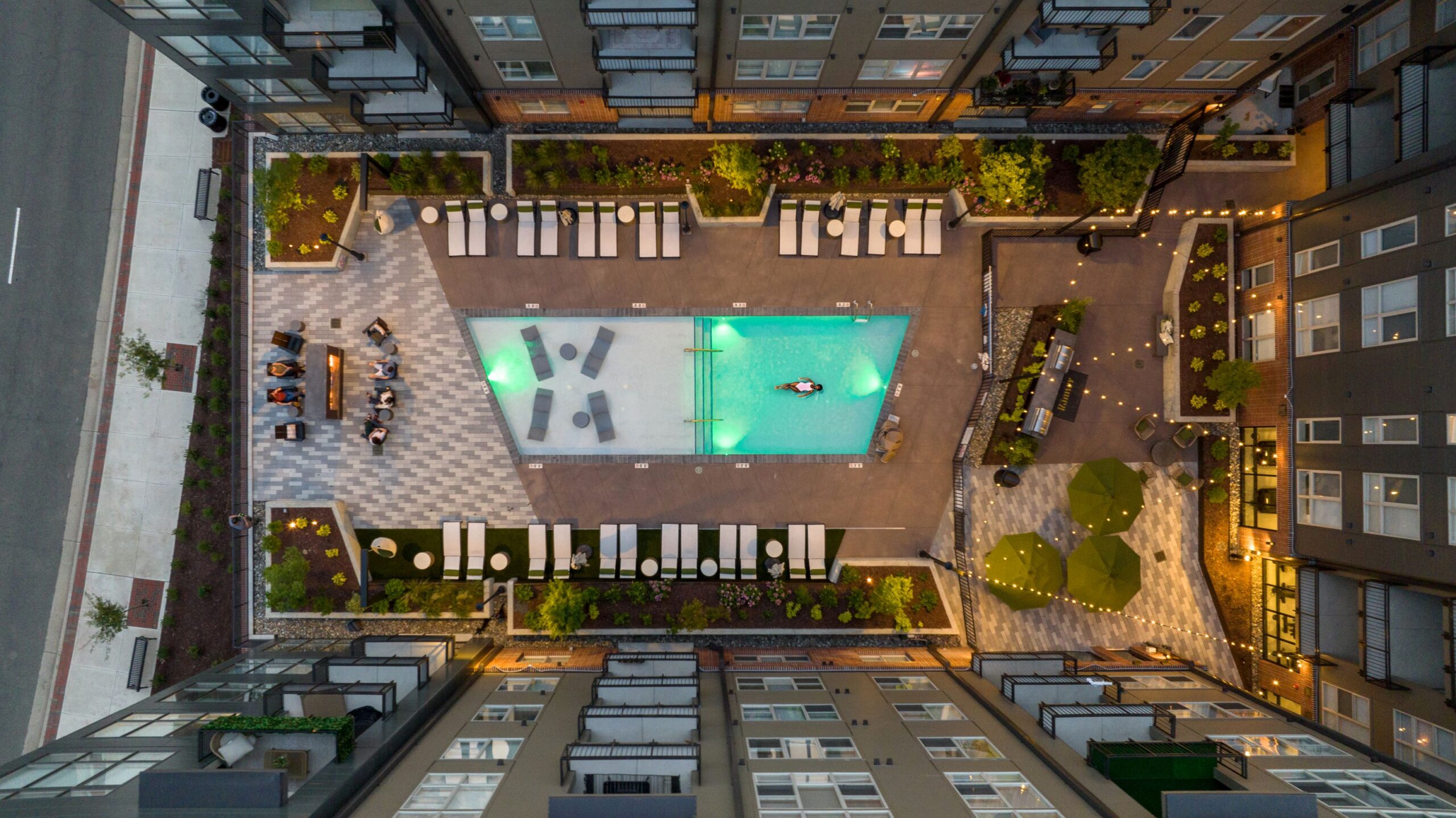 The Ramsey central social courtyard with pool and firepit area