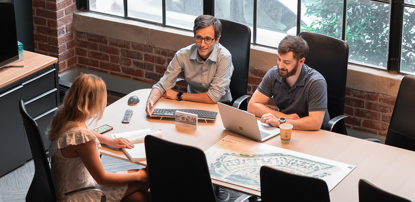 Designers collaborating at conference table