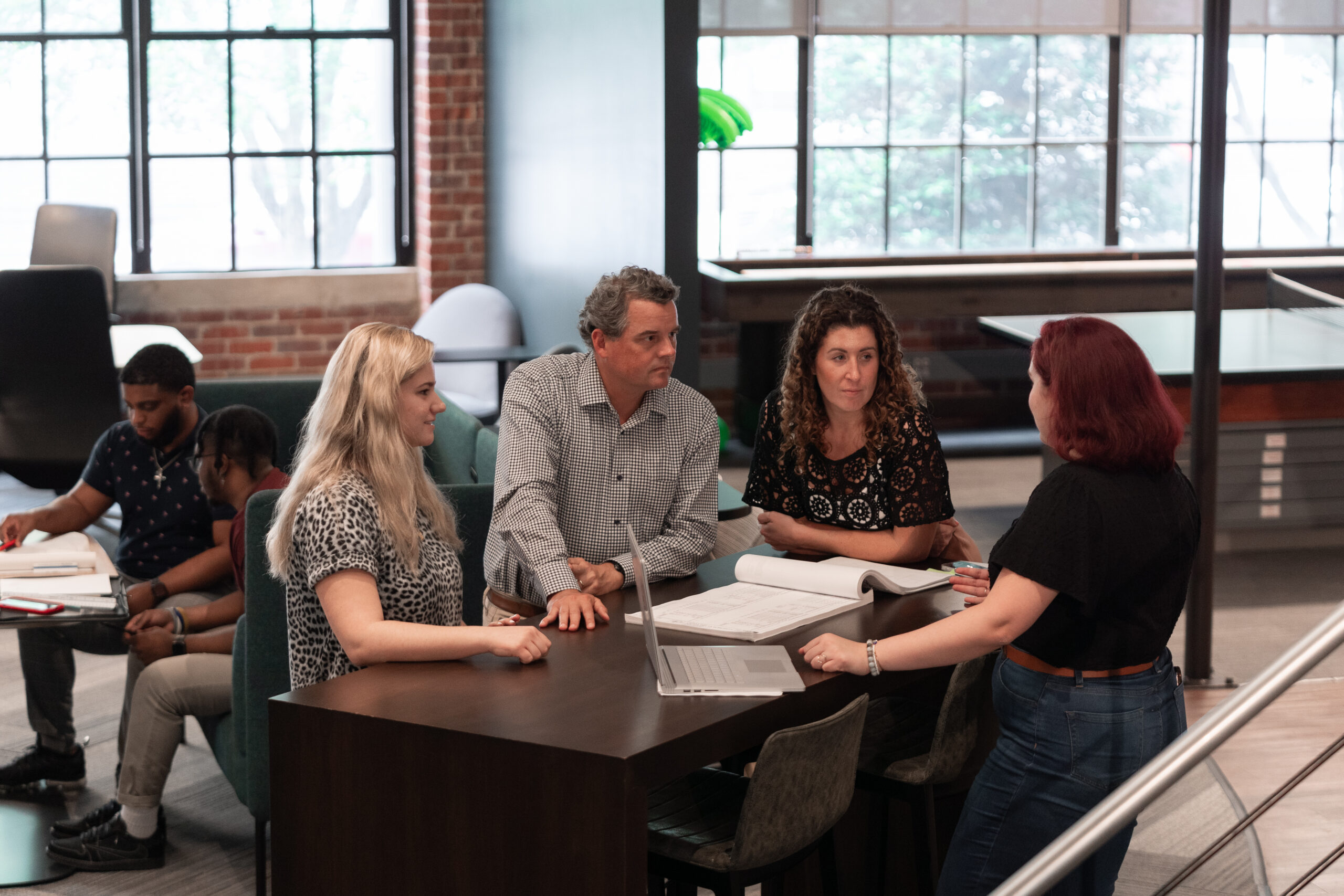 Staff at Cline Raleigh gather to discuss project